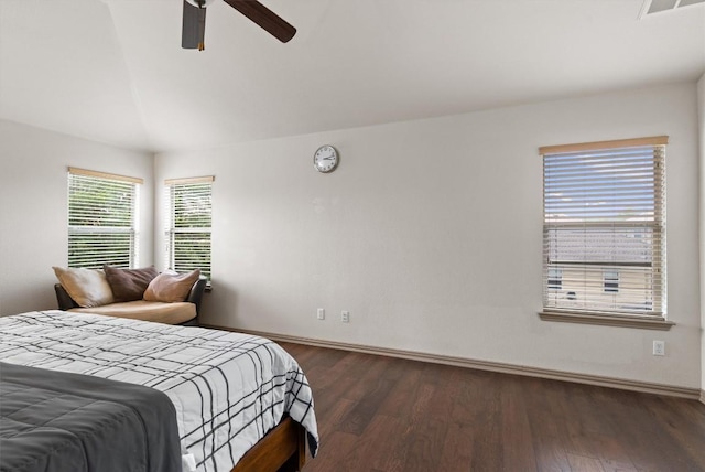 bedroom featuring baseboards, a ceiling fan, vaulted ceiling, and wood finished floors