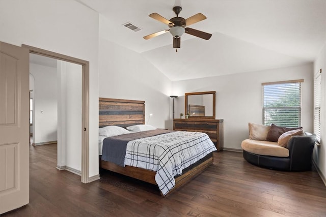 bedroom with baseboards, vaulted ceiling, wood finished floors, and visible vents