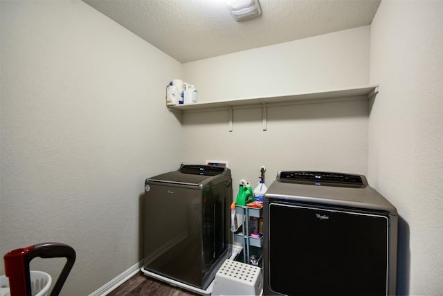 217 Frederick Dr, Georgetown, TX 78626 - laundry room with washer and dryer and dark wood-type flooring