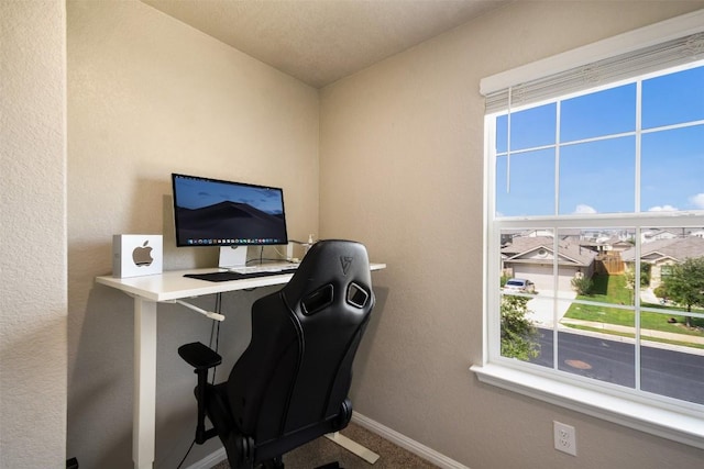 office area with baseboards and carpet floors