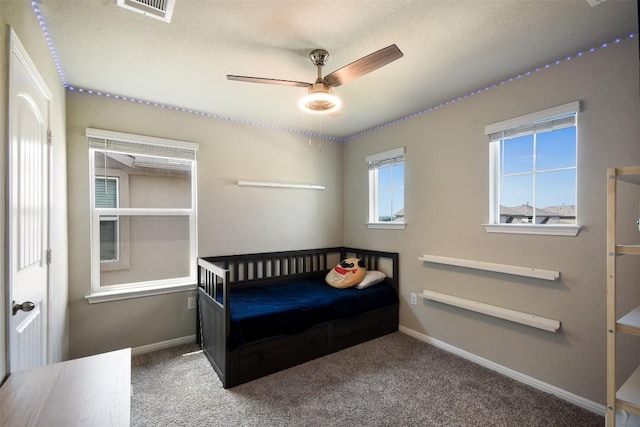 217 Frederick Dr, Georgetown, TX 78626 - carpeted bedroom featuring baseboards and a ceiling fan