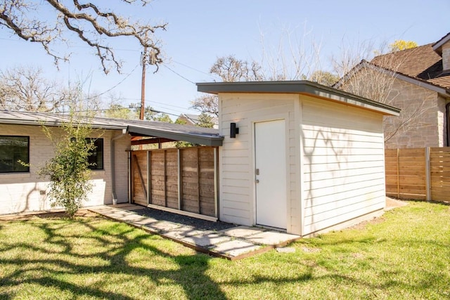 view of shed with fence