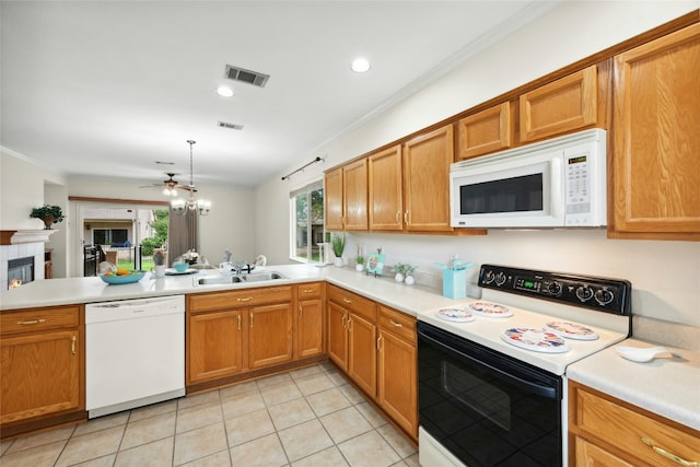 508 Texas Dr, Georgetown, TX 78633 - kitchen with visible vents, a sink, light tile patterned floors, light countertops, and white appliances