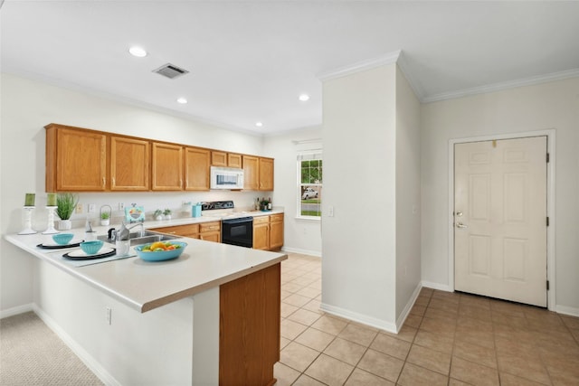 508 Texas Dr, Georgetown, TX 78633 - kitchen with light countertops, a sink, white microwave, electric stove, and ornamental molding