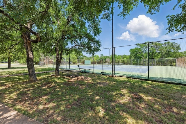view of tennis court with fence