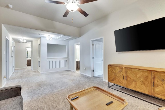 4129 Godwit Dr, Pflugerville, TX 78660 - unfurnished living room featuring attic access, a ceiling fan, and light colored carpet