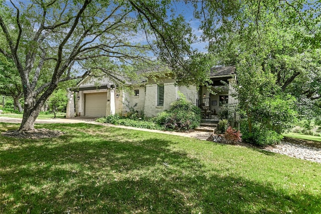 2305 Barton Creek Blvd Unit 28, Austin, TX 78735 - obstructed view of property with concrete driveway, an attached garage, a front yard, and stucco siding