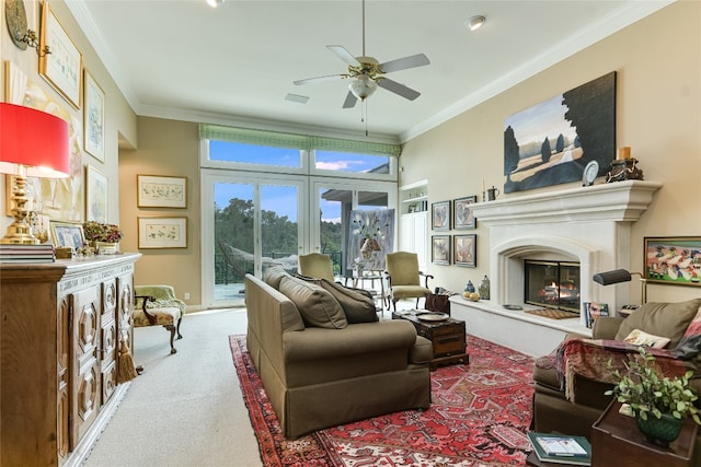 2305 Barton Creek Blvd Unit 28, Austin, TX 78735 - living area with carpet floors, ornamental molding, a glass covered fireplace, and ceiling fan