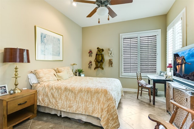 2305 Barton Creek Blvd Unit 28, Austin, TX 78735 - tiled bedroom with baseboards and a ceiling fan