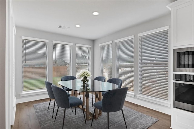 1400 Mulberry Oak Ln, Georgetown, TX 78628 - dining area featuring dark wood-type flooring and recessed lighting