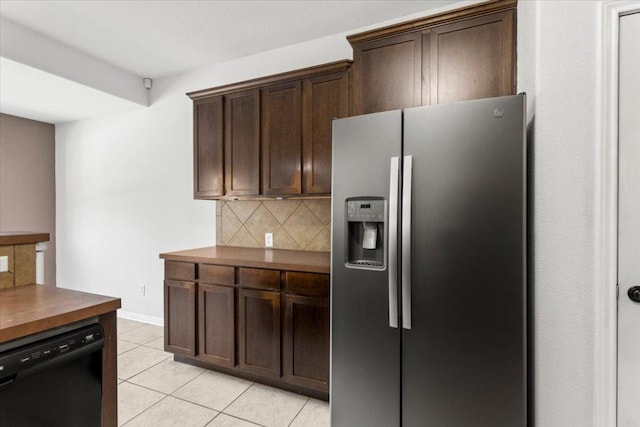 kitchen featuring stainless steel fridge with ice dispenser, dark brown cabinets, black dishwasher, tasteful backsplash, and light tile patterned floors