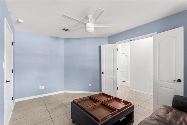 living room with light tile patterned floors, baseboards, a ceiling fan, and visible vents