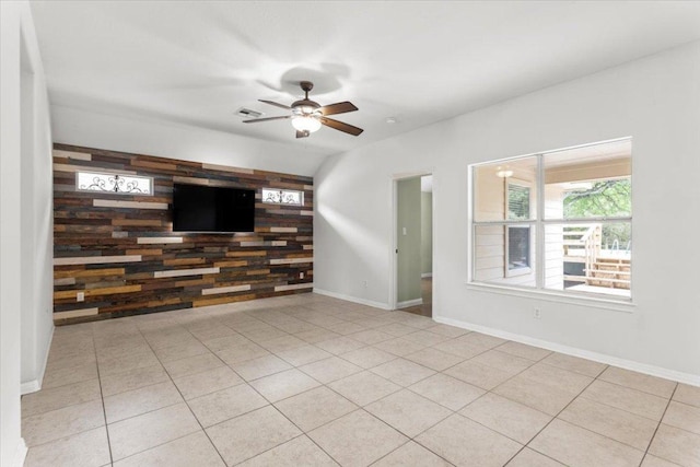 unfurnished living room featuring ceiling fan, visible vents, baseboards, and tile patterned flooring