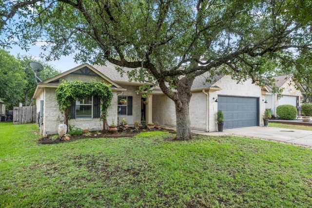 single story home with driveway, a front yard, fence, an attached garage, and stucco siding