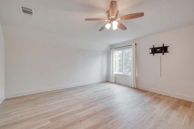 15203 Dormax Cir, Leander, TX 78641 - spare room with lofted ceiling, light wood finished floors, a ceiling fan, and baseboards