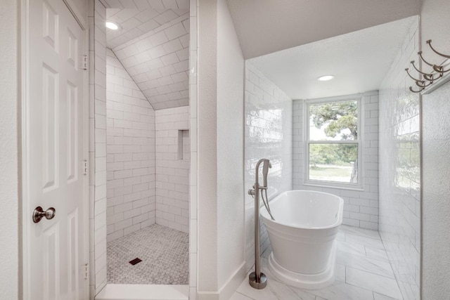 15203 Dormax Cir, Leander, TX 78641 - bathroom with a freestanding bath, a tile shower, recessed lighting, and marble finish flooring