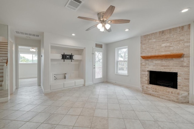 15203 Dormax Cir, Leander, TX 78641 - unfurnished living room with a ceiling fan, stairway, a fireplace, tile patterned flooring, and recessed lighting