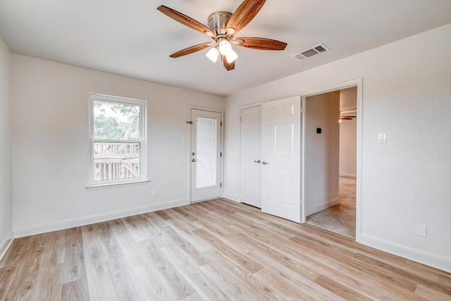 15203 Dormax Cir, Leander, TX 78641 - unfurnished bedroom with baseboards, light wood-style floors, and a ceiling fan