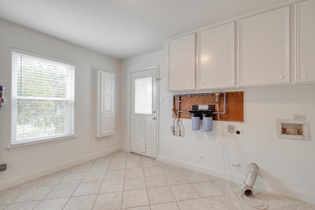 15203 Dormax Cir, Leander, TX 78641 - laundry area with electric dryer hookup, cabinet space, and plenty of natural light