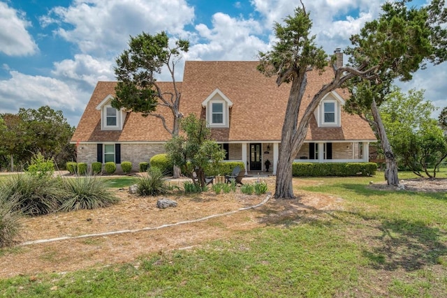 15203 Dormax Cir, Leander, TX 78641 - cape cod-style house with a front lawn
