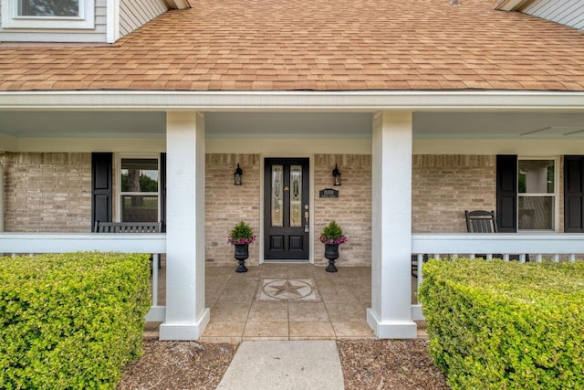 15203 Dormax Cir, Leander, TX 78641 - property entrance featuring a shingled roof and brick siding