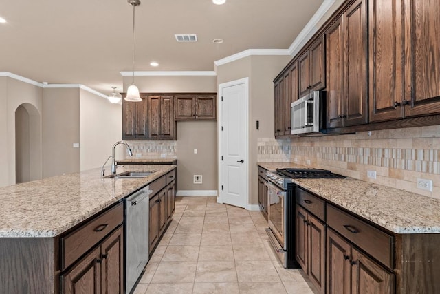 kitchen with crown molding, a sink, appliances with stainless steel finishes, and backsplash
