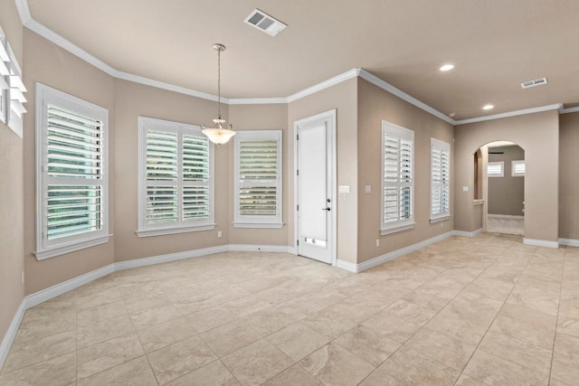 unfurnished room with visible vents, arched walkways, crown molding, and light tile patterned floors