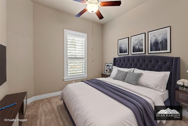 carpeted bedroom with baseboards and a ceiling fan