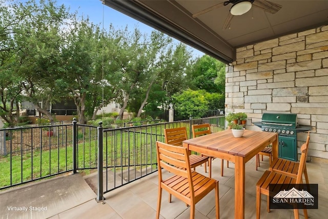 balcony with a ceiling fan, outdoor dining space, and a grill