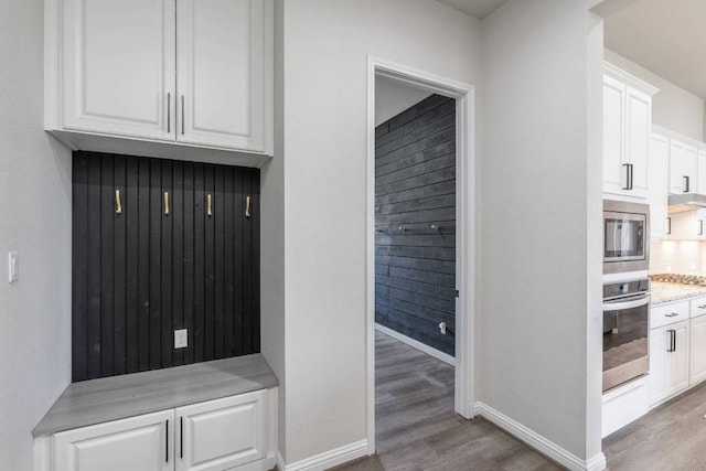 112 Bittik Cv, Georgetown, TX 78628 - mudroom with wood finished floors and arched walkways
