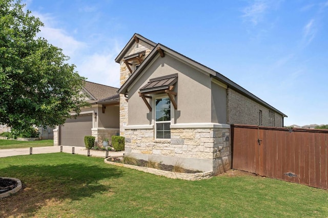 112 Bittik Cv, Georgetown, TX 78628 - view of property exterior with stone siding, stucco siding, an attached garage, and driveway