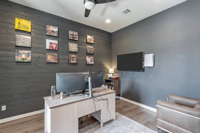 112 Bittik Cv, Georgetown, TX 78628 - office space with wood finished floors, an accent wall, ceiling fan, wood walls, and recessed lighting