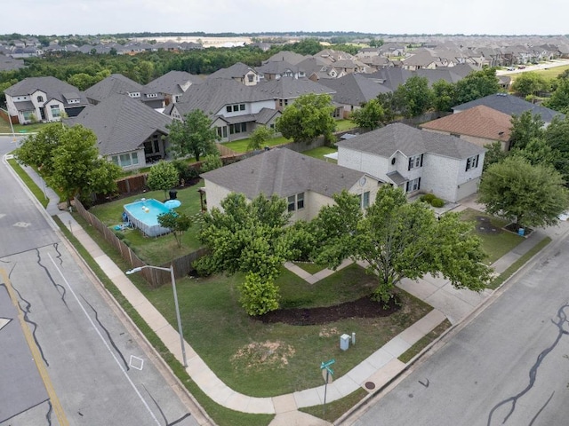 birds eye view of property with a residential view