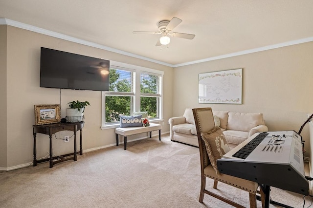 carpeted living room featuring baseboards, ornamental molding, and a ceiling fan