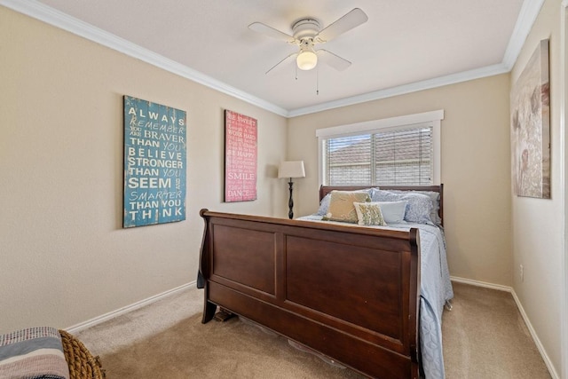 carpeted bedroom with crown molding, baseboards, and a ceiling fan