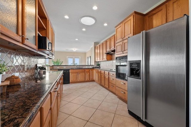 12401 Fairfax Ridge Pl, Austin, TX 78738 - kitchen featuring light tile patterned flooring, recessed lighting, a sink, backsplash, and black appliances