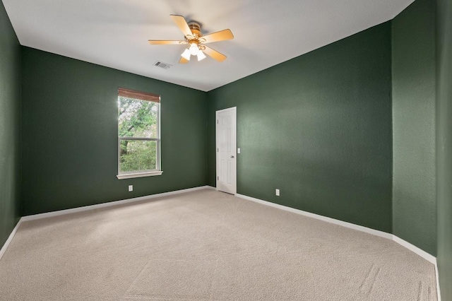 12401 Fairfax Ridge Pl, Austin, TX 78738 - empty room with carpet floors, baseboards, a ceiling fan, and visible vents