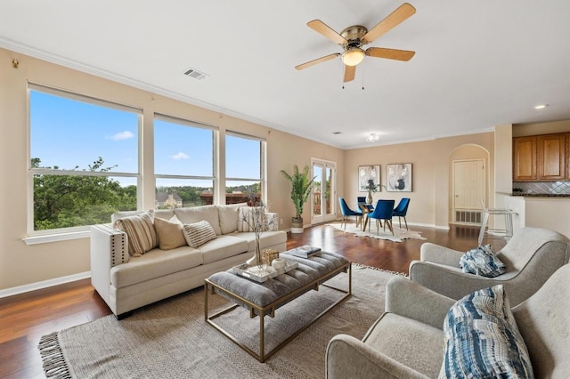12401 Fairfax Ridge Pl, Austin, TX 78738 - living room with crown molding, baseboards, wood finished floors, and a wealth of natural light