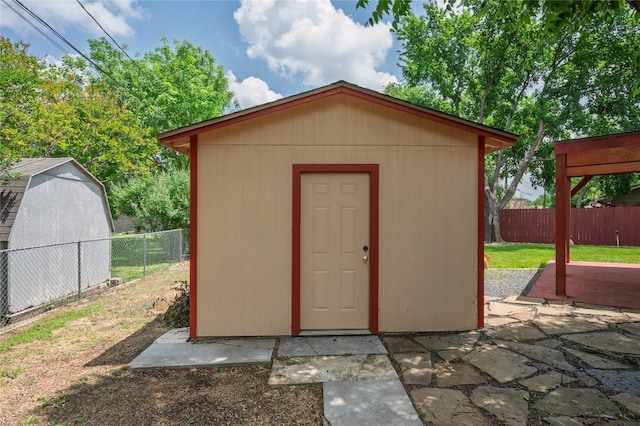 view of shed with a fenced backyard