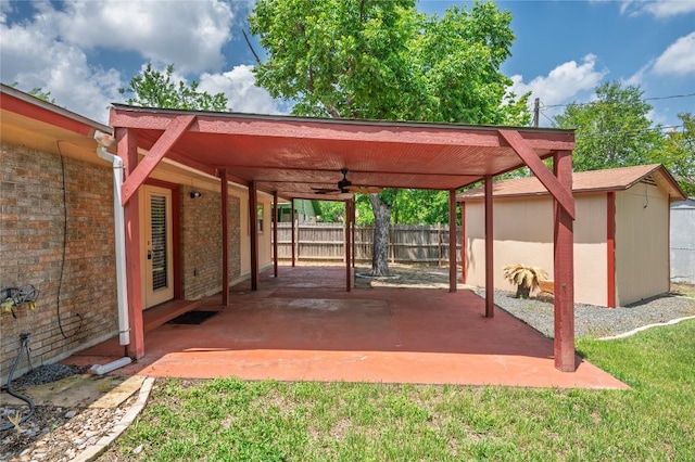 view of patio featuring a ceiling fan and fence