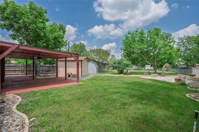 view of yard with a patio and a fenced backyard