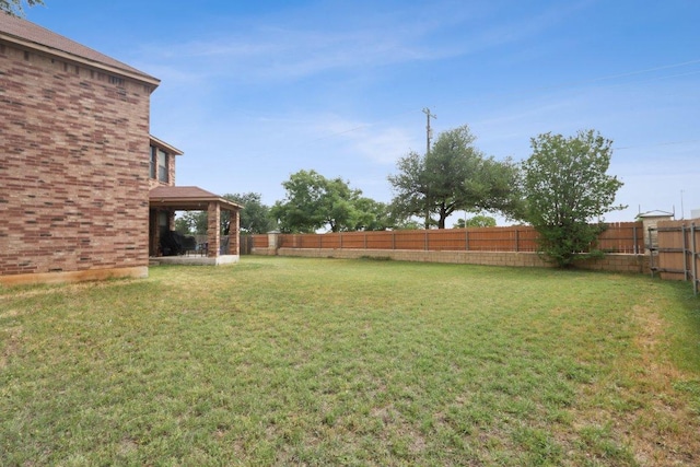 view of yard with a fenced backyard