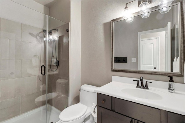 5684 Sabbia Dr, Round Rock, TX 78665 - bathroom with vanity, a shower stall, and a textured wall
