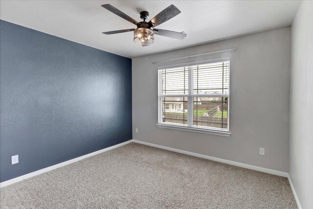5684 Sabbia Dr, Round Rock, TX 78665 - unfurnished room featuring ceiling fan, carpet floors, and a textured wall