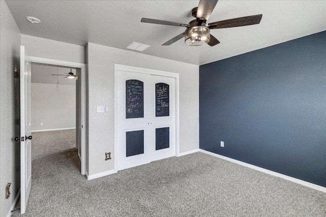 5684 Sabbia Dr, Round Rock, TX 78665 - unfurnished bedroom with carpet floors and a ceiling fan