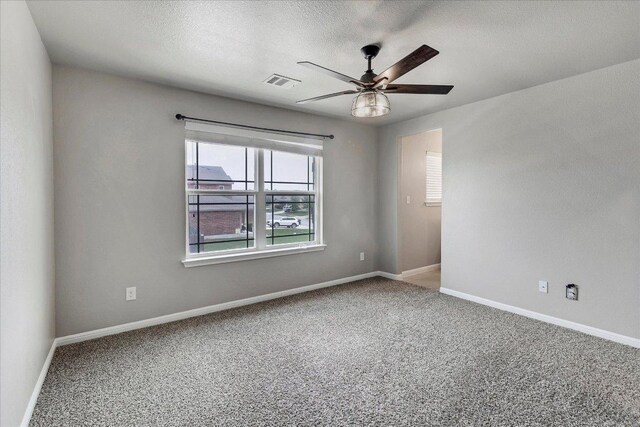 5684 Sabbia Dr, Round Rock, TX 78665 - carpeted spare room with a ceiling fan and a textured ceiling