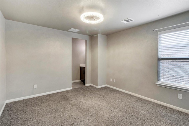 5684 Sabbia Dr, Round Rock, TX 78665 - carpeted empty room with baseboards