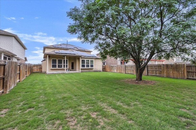 5684 Sabbia Dr, Round Rock, TX 78665 - back of property with solar panels and a fenced backyard