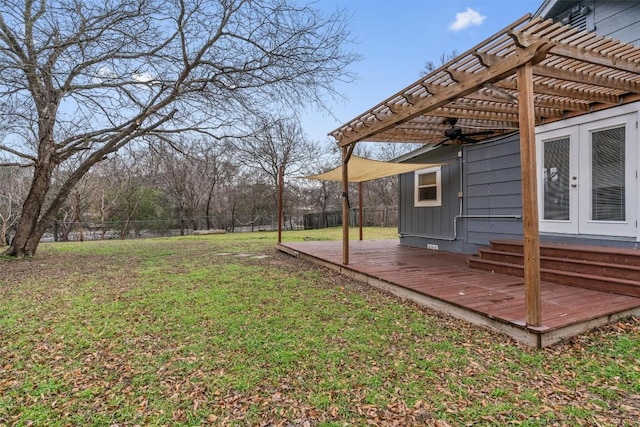 1802 Webberville Rd, Austin, TX 78721 - view of yard with ceiling fan, a wooden deck, a pergola, a fenced backyard, and french doors