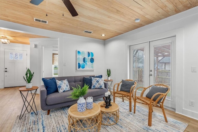 1802 Webberville Rd, Austin, TX 78721 - living area featuring visible vents, wooden ceiling, french doors, and light wood-type flooring